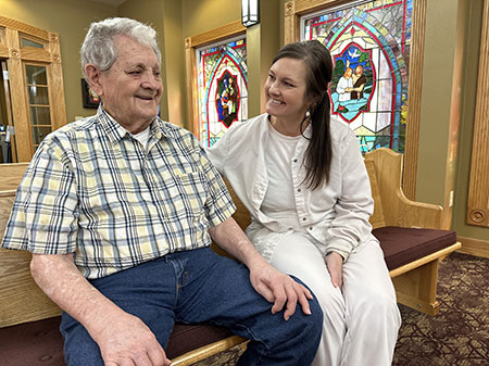 Resident and nurse in chapel